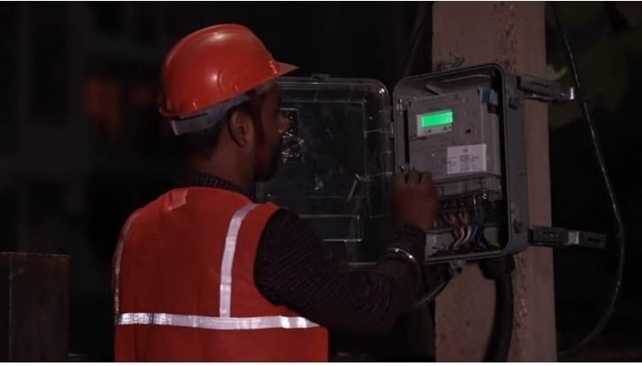 Technician installing a smart meter