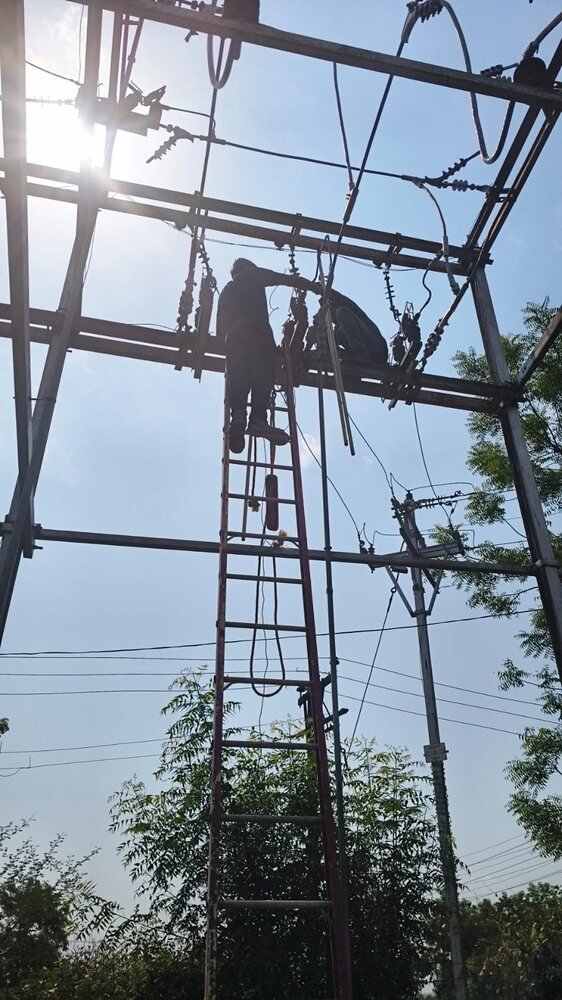 Workers performing electrical site work